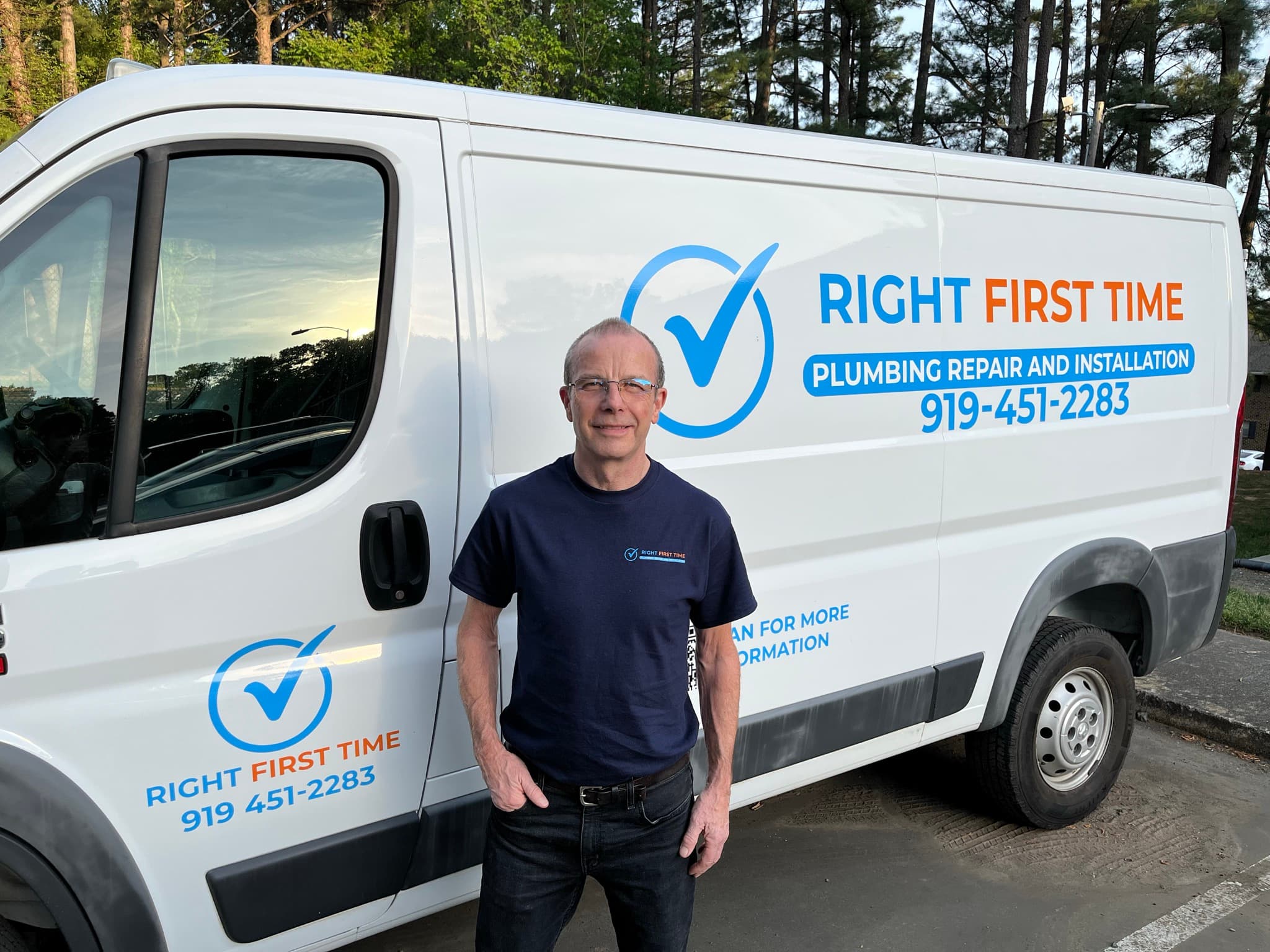Owen McDermott standing next to his Right First Time Plumbing van